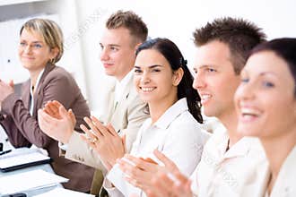 Clapping business people