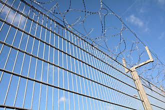 A fence with barbed wire