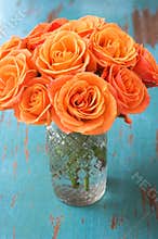 Orange rose flowers in vase