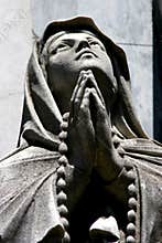 Statue of a praying person