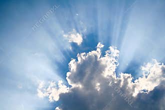 Sun shining through clouds