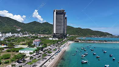 Aerial view of Ana Marina Nha Trang with traditional fishing boats in blue sea in the North of city, central Vietnam