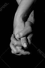 Holding two hands together. Union and love concept.