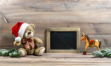 Christmas decoration with antique toys teddy bear and rocking ho