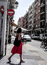 People going about their daily lives in the streets of the city of Valencia