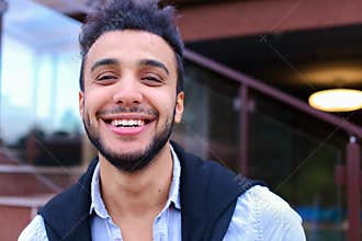Portrait of cheerful young male Muslim. Man smiling and posing a