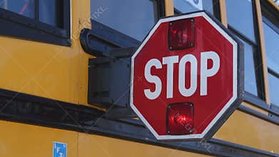 An extended school bus stop paddle