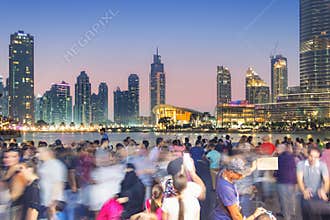 Crowd photographs the Dubai skyline