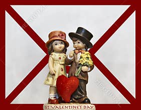 Cute Valentines ornament in front of a love letter