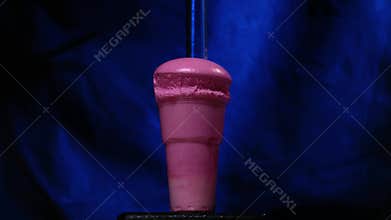 Chemical reaction in volumetric flask glass in laboratory. The chemical pink reagent in a transparent bottle. Chemical