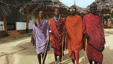 The Masai tribe dances national dance at sunset and bids farewell to the sun. 4K