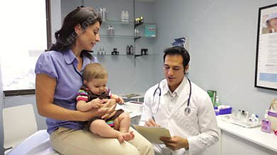 Mother And Baby Visiting Doctor's Office