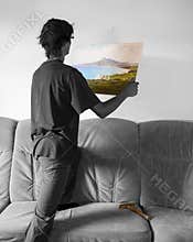Hanging a colorful Landscape painting on blank white wall