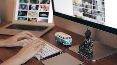 Designing at Wood Desk with Wireframe and Computer