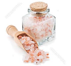 Himalayan pink salt in a glass bottle