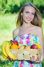 Happy girl and healthy vegetarian food, fruit