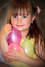Happy Little Girl with Balloons