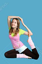 Young girl exercises yoga
