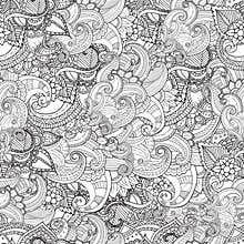 Hand drawn artistic ethnic ornamental patterned floral frame in doodle style for adult coloring pages.