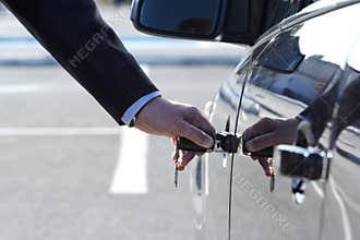Person Inserting Car Key