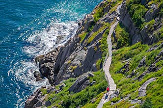 Cabot Trail with hikers staying in shape, walking along in St John's, Newfoundland.