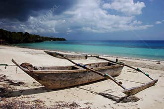 Single old wooden ship on the beach in Zanzibar