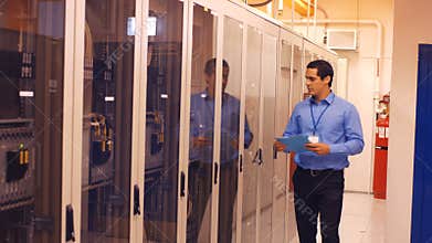 Technician walking in server room