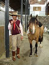 Gaucho with his horse with the characteristic clothing in Argentina