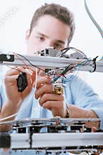 Young engineer using a 3D printer
