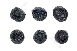 Dried prunes isolated on white