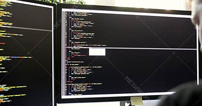 Programmer working in office writing programming code