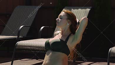 Bikini Girl selfie at the edge of swimming pool