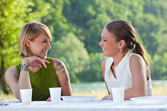 Female friends picknicking
