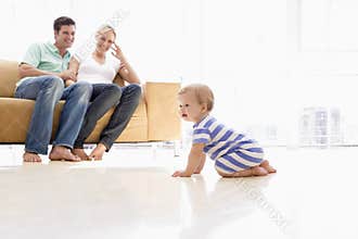 Couple in living room with baby