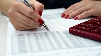 woman audit financial reports