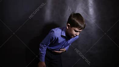 Boy teenager stomach ache diarrhea in a blue shirt