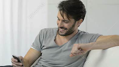 Young Man Texting On Cellphone