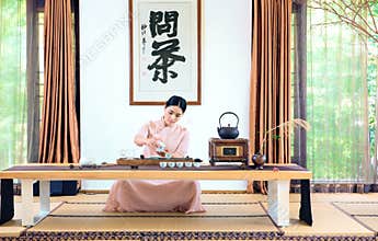A woman with a teapot-China tea ceremony