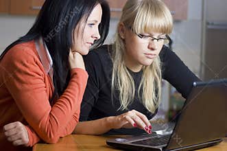 Two women on laptop