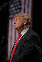 LAS VEGAS NEVADA, DECEMBER 14, 2015: Republican presidential candidate Donald Trump profile and flag at campaign event at Westgate