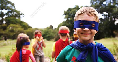 Group of kids pretending to be a super hero