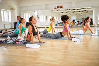 Fitness group train on mats