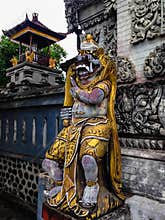 Hindu Balinese Guard Statue In Front Of The Temple Gate At Patemon Village