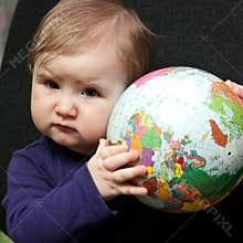Baby girl with world globe
