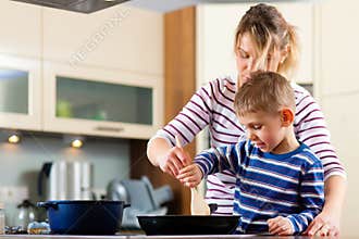 Family cooking in kitchen