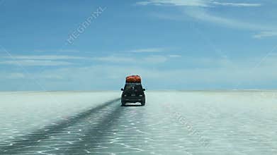Driving on salt flats in Bolivia
