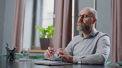 Employee Focused On Writing Letter to Manager .