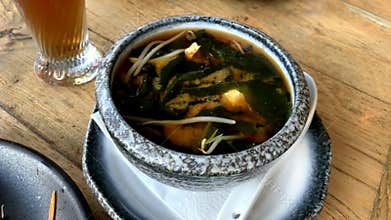 Miso soup in the big ceramic bowl. It is traditional japanese food.