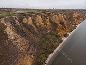 Aerial Shot of clay hills with canyons near the Black sea at Misty Autumn weather. Stanislavs mountains, Kherson region
