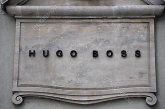 Hugo Boss luxury fashion brand logo on an ancient building in Florence Italy 